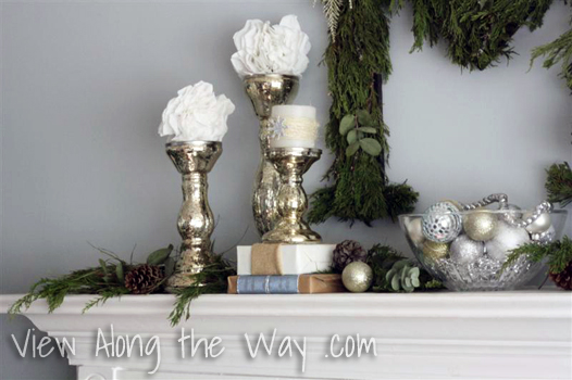Silver Candlesticks with white candles and snowballs on a Christmas Mantle