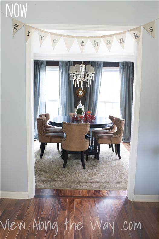Dining Room: Dark brown walls, crystal chandelier, burlap banner