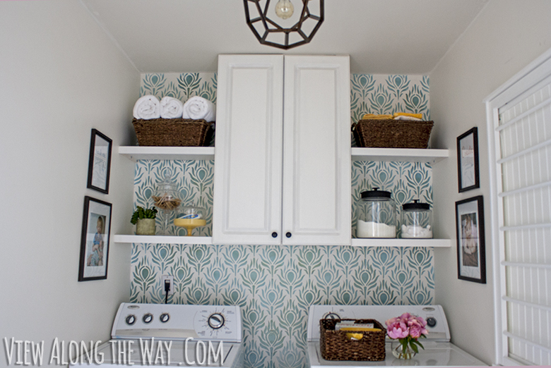 Updated laundry room with stenciled walls, DIY light and cabinetry