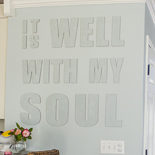 Hang canvas letters on the wall - plus TONS of other creative, budget-friendly feature wall ideas!