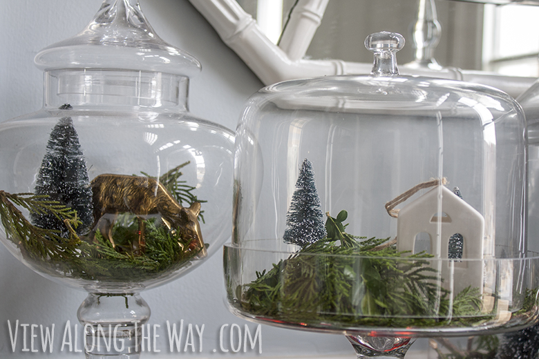 Make a little Christmas scene with greenery and ornaments in glass jars!