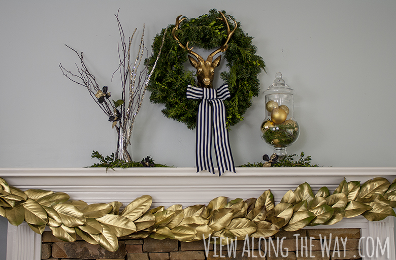 Christmas mantel: brass deer with greenery and a DIY golden magnolia garland!