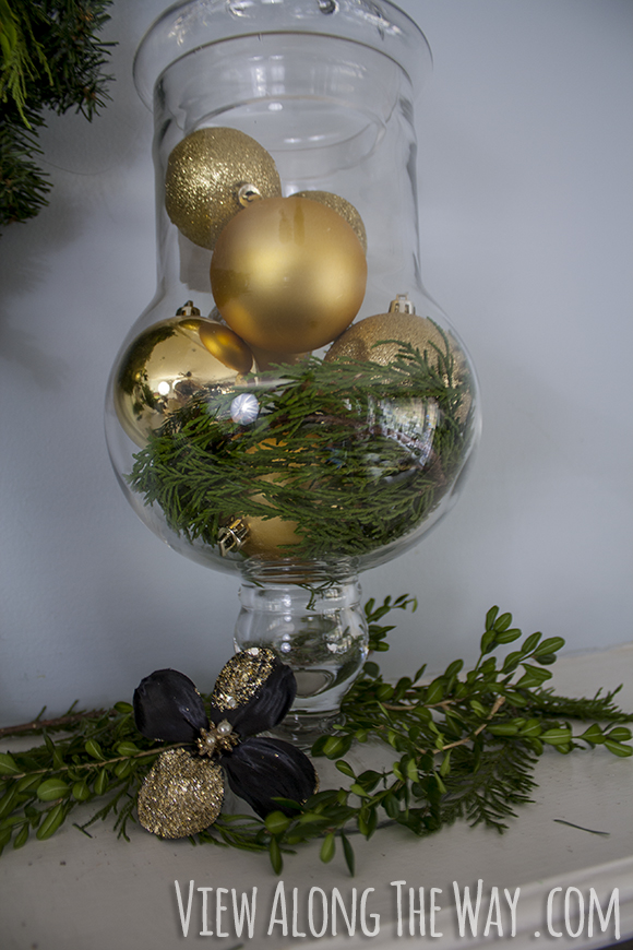Apothecary jar of golden ornaments for Christmas