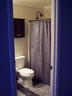 Tan bathroom gray shower curtain