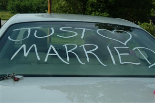 Just married on back of car