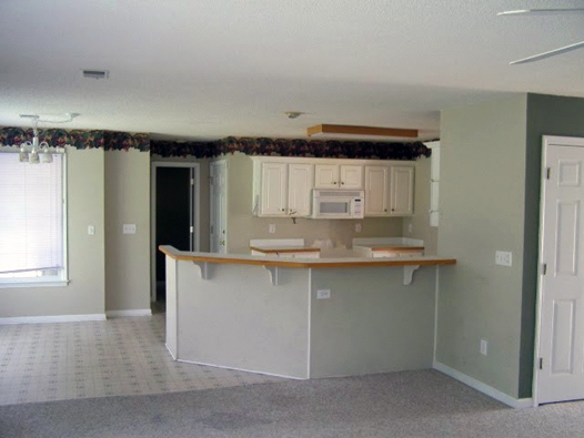 Kitchen Before: Border, White Laminate Cabinets, Vinyl Floors