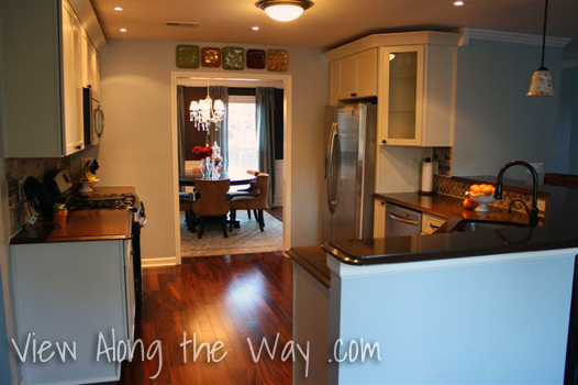 Updated Kitchen, Dark Wood Floors, Brittany Blue Walls, Angled Cabinet