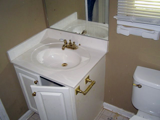 Powder Half Bathroom Before: Brass Fixtures, White Vanity