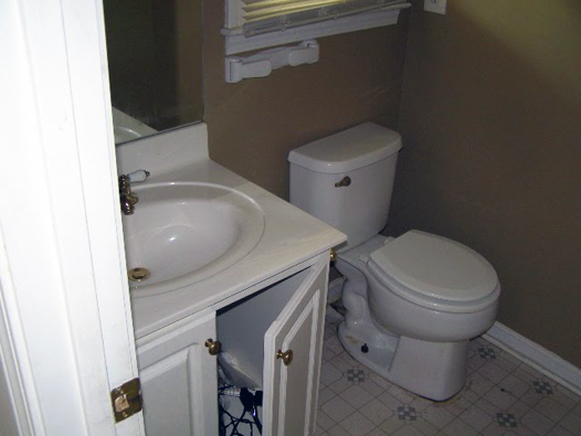 Powder Half Bathroom Before: Brass Fixtures, White Vanity