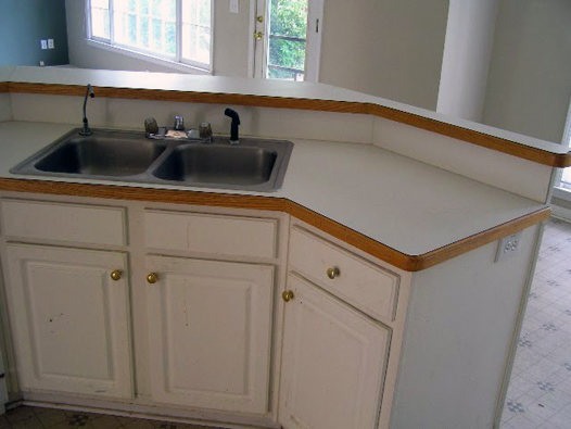 Kitchen Before: Border, White Laminate Cabinets, Vinyl Floors 4