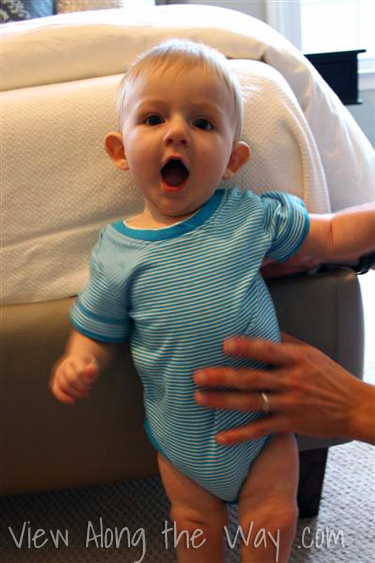 Baby on upholstered platform bed