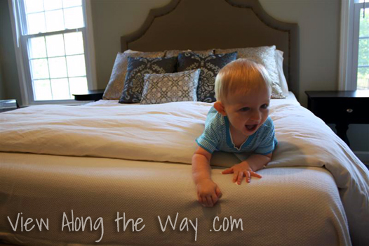 Baby on upholstered platform bed