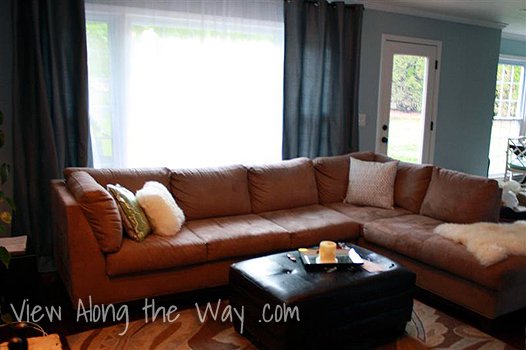 Living room: tan sectional, leather ottoman