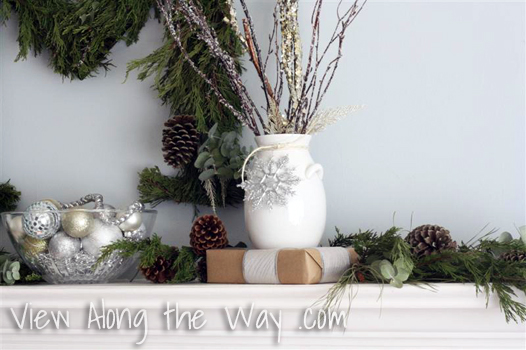 White Vase with Silver snowflake and branches on a Christmas Mantle/mantel