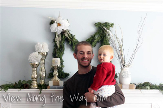 Father and Son in front of a Christmas Mantel