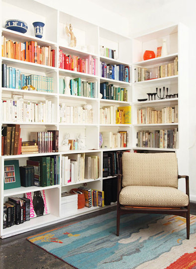 Library with books arranged by color