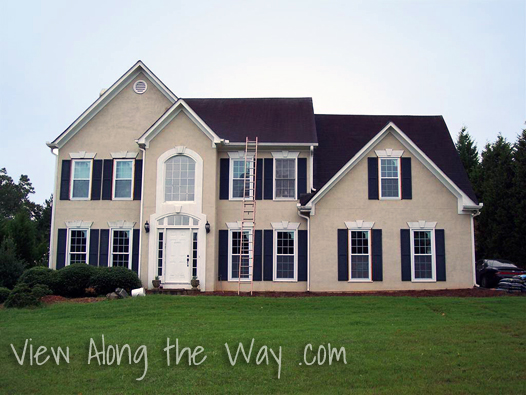 House Exterior: Beige with Black shutters and black roof