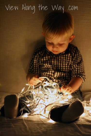 Toddler with Christmas lights