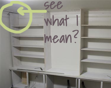 White bookcase shop with crown molding