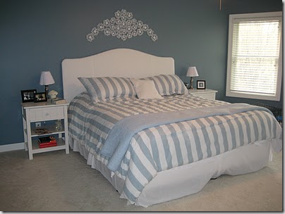 blue bedroom with white bed