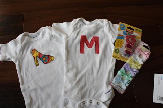 appliqued baby onesies