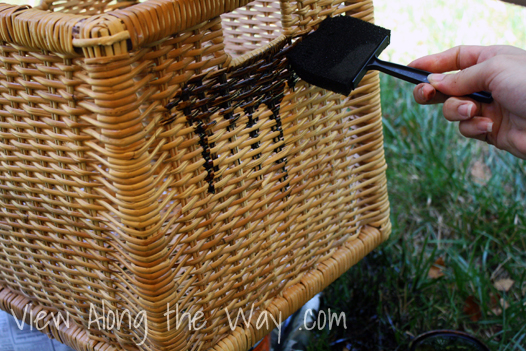 Wood stain on wicker storage baskets with foam brush