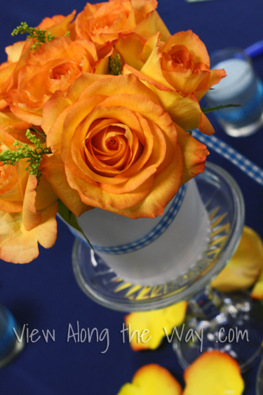 Orange Rose Centerpiece on Navy Tablecloth