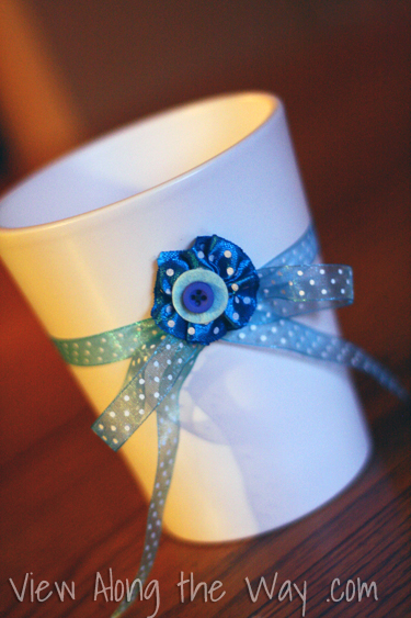 White Vase with Blue Ribbon