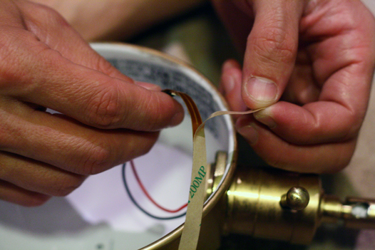 Removing adhesive backing from led reel light strips