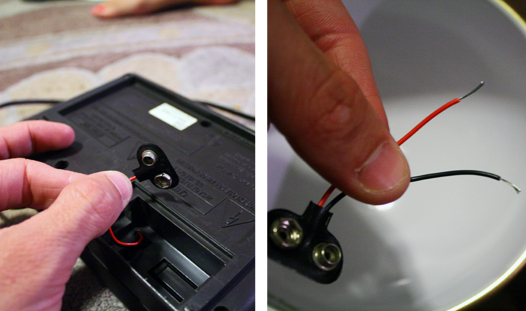 Taking a nine-volt battery pack off an old alarm clock