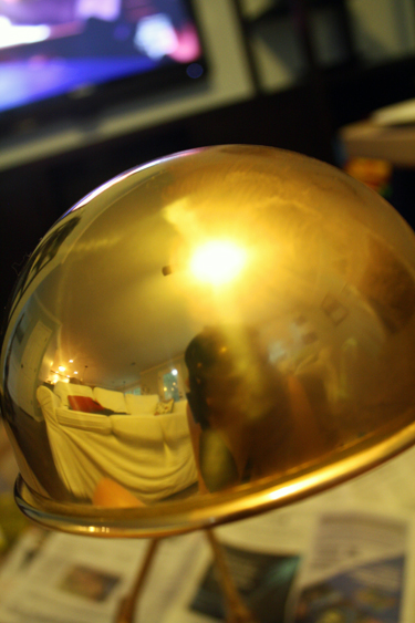 Before and after antique gold rub-n-buff on a brass lamp