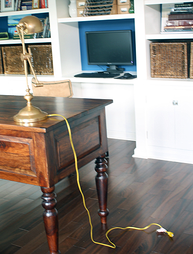 lamp on desk with cord in the way