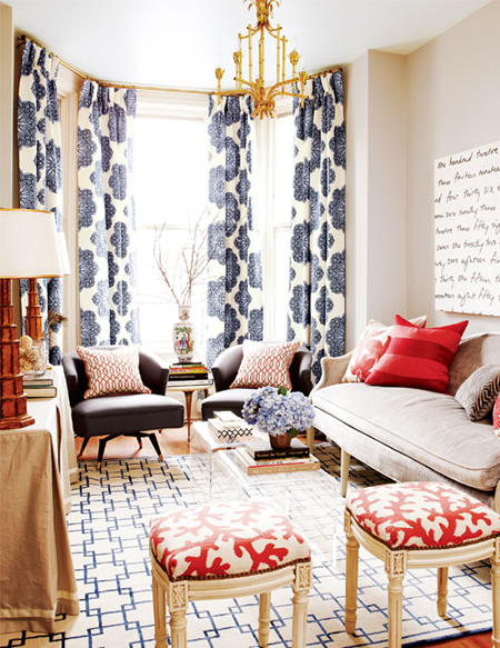 Living room: Blue white drapes, coral ottomans
