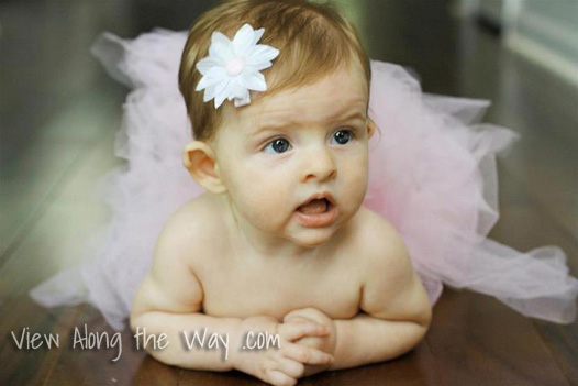 Baby girl in tutu with hair flower