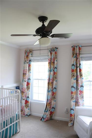 Baby girl nursery with ceiling fan