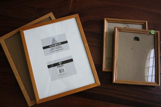 Four medium wood picture frames