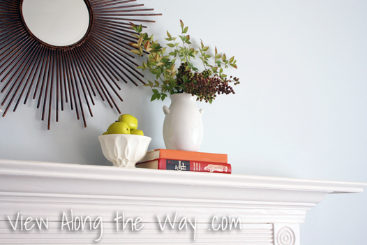 Decorations on a mantle for fall, heavenly bamboo berries