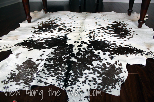 White and brown cowhide rug