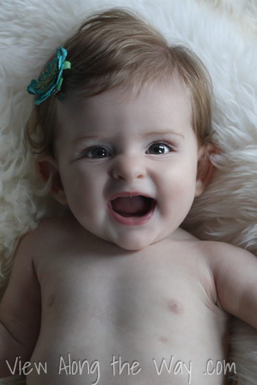 smiling baby on sheepskin