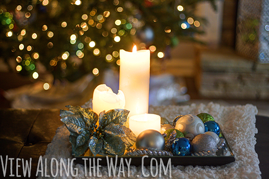 Candlelit Christmas Vignette: Mirrored tray with pillar candles and Christmas ornaments