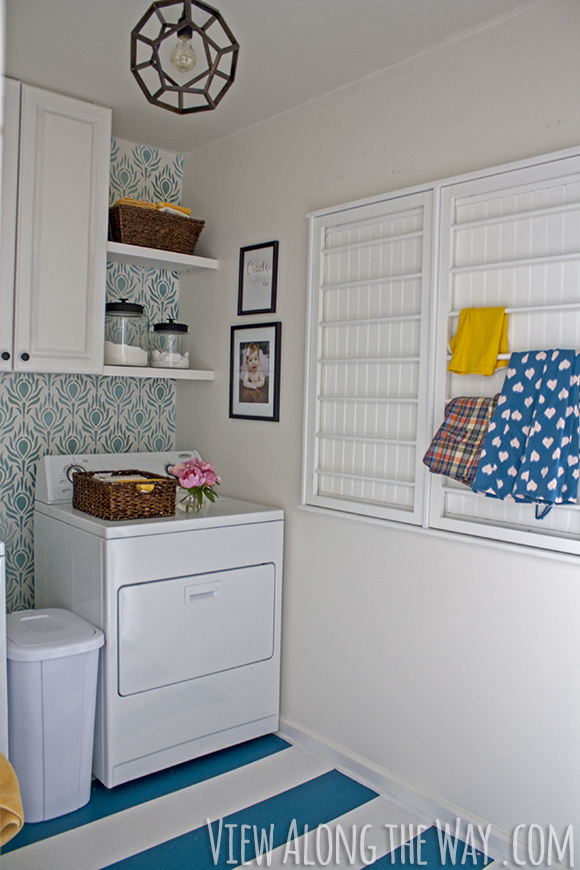 Laundry room makeover for only $157! Painted floors, stenciled walls... come see how it was done!