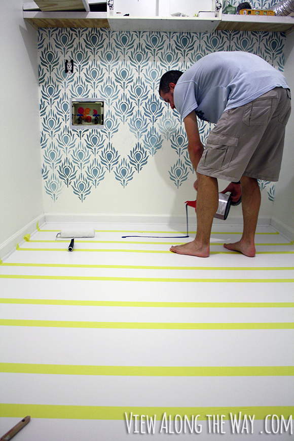 How to paint vinyl/laminate floors! It's easy and inexpensive! Click through for the full tutorial!