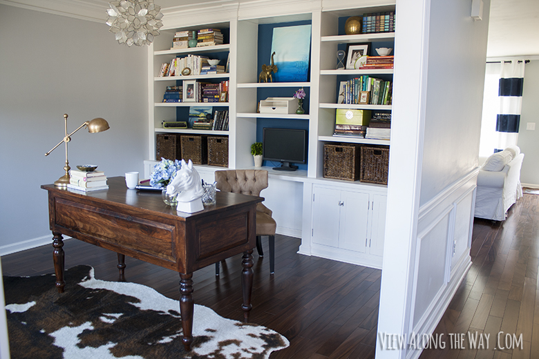 Office with built-in bookshelves and DIY capiz chandelier at View Along the Way