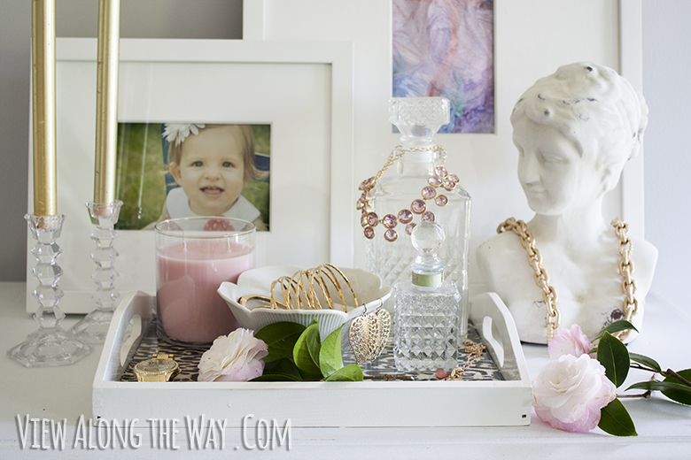 Styled vanity tray with bust
