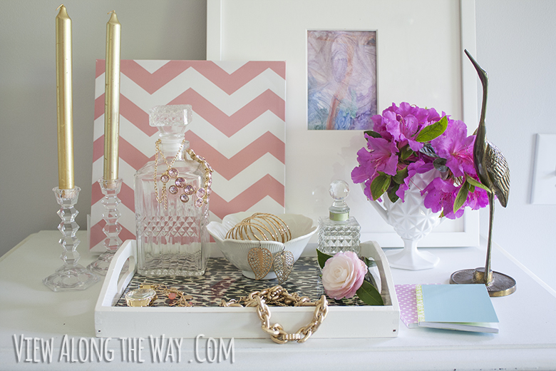 Styled vanity tray with art and flowers