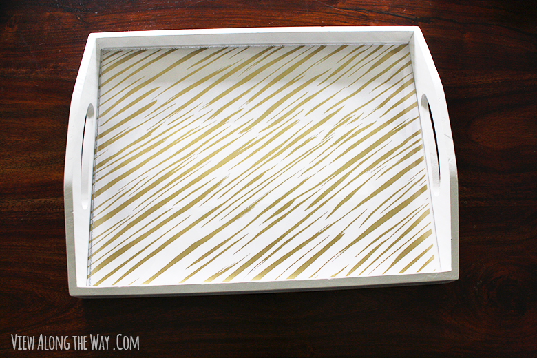 Painted tray with gold and white wrapping paper liner