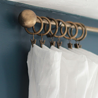 Make DIY curtain rods that look like antique brass -- plus TONS of other creative DIY curtain rod ideas!