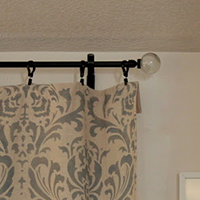 Add a finial to a DIY curtain rod -- plus many, many more brilliant DIY drapery rod ideas!