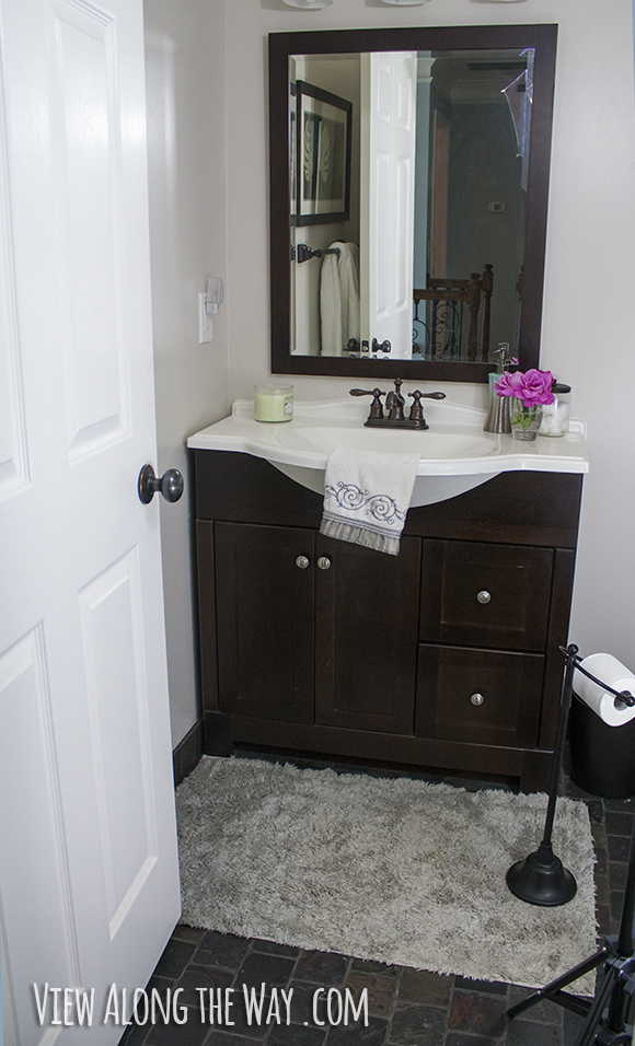 Bathroom with dark wood and slate tile