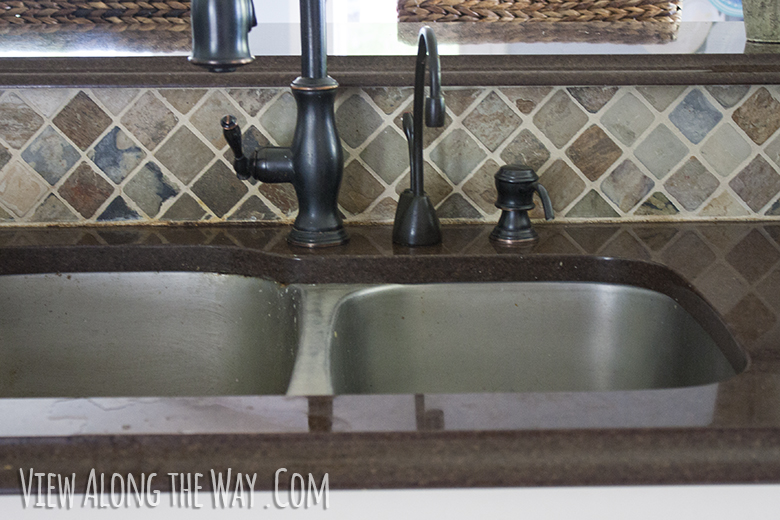Oil-rubbed bronze faucet and slate backsplash